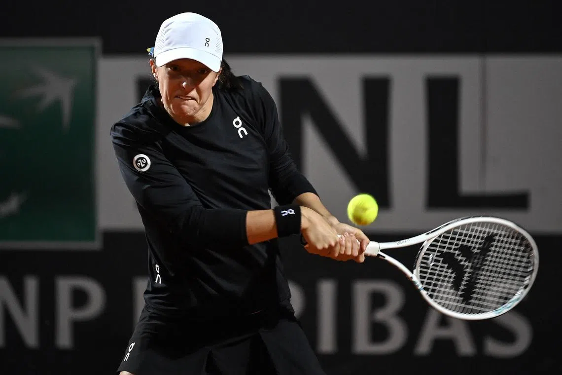 Poland's Iga Swiatek (above) forfeits her Italian Open quarter-final clash against Elena Rybakina of Kazakhstan after the world No. 1 suffered a thigh injury.