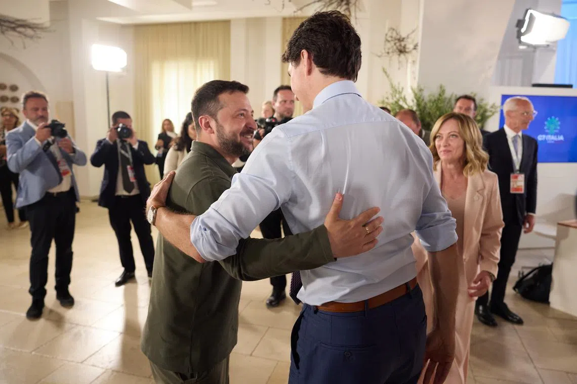 Ukrainian President Volodymyr Zelensky (left) at the G-7 Summit with Canadian Prime Minister Justin Trudeau and Italian Prime Minister Giorgia Meloni.
