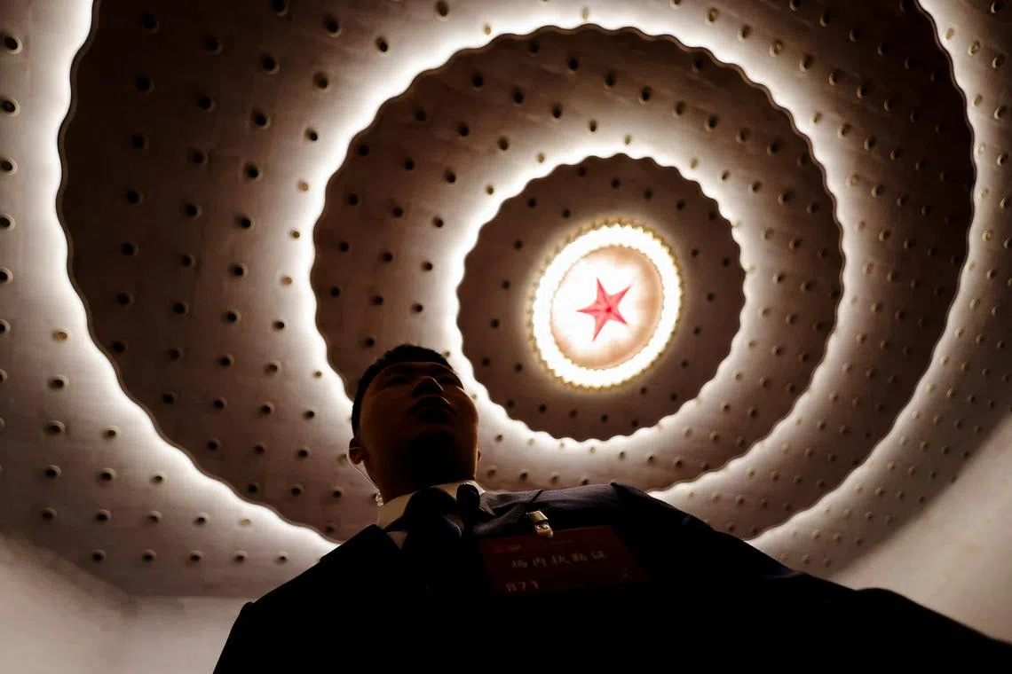 A member of the security personnel standing, ahead of the opening session of the Chinese People's Political Consultative Conference (CPPCC), at the Great Hall of the People in Beijing, China, on March 4, 2026. 