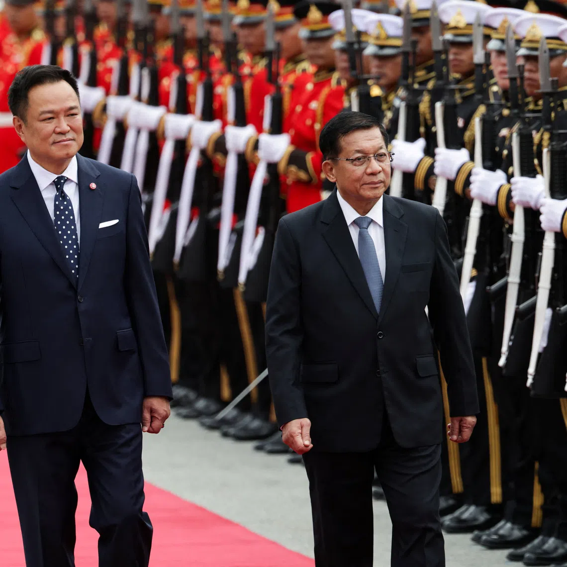 Thailand Prime Minister Anutin Charnvirakul (left) and Myanmar President Min Aung Hlaing review a guard of honour during a welcoming ceremony at the Government House in Bangkok on Aug 6.