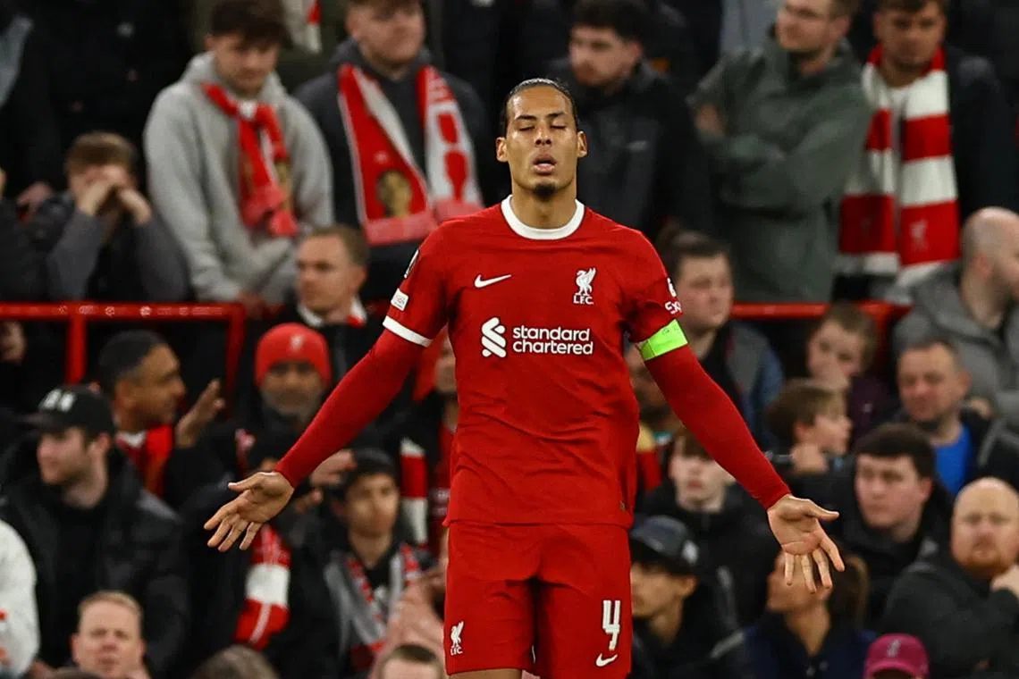 Liverpool's Virgil van Dijk looks dejected after Atalanta's Mario Pasalic scores their third goal.