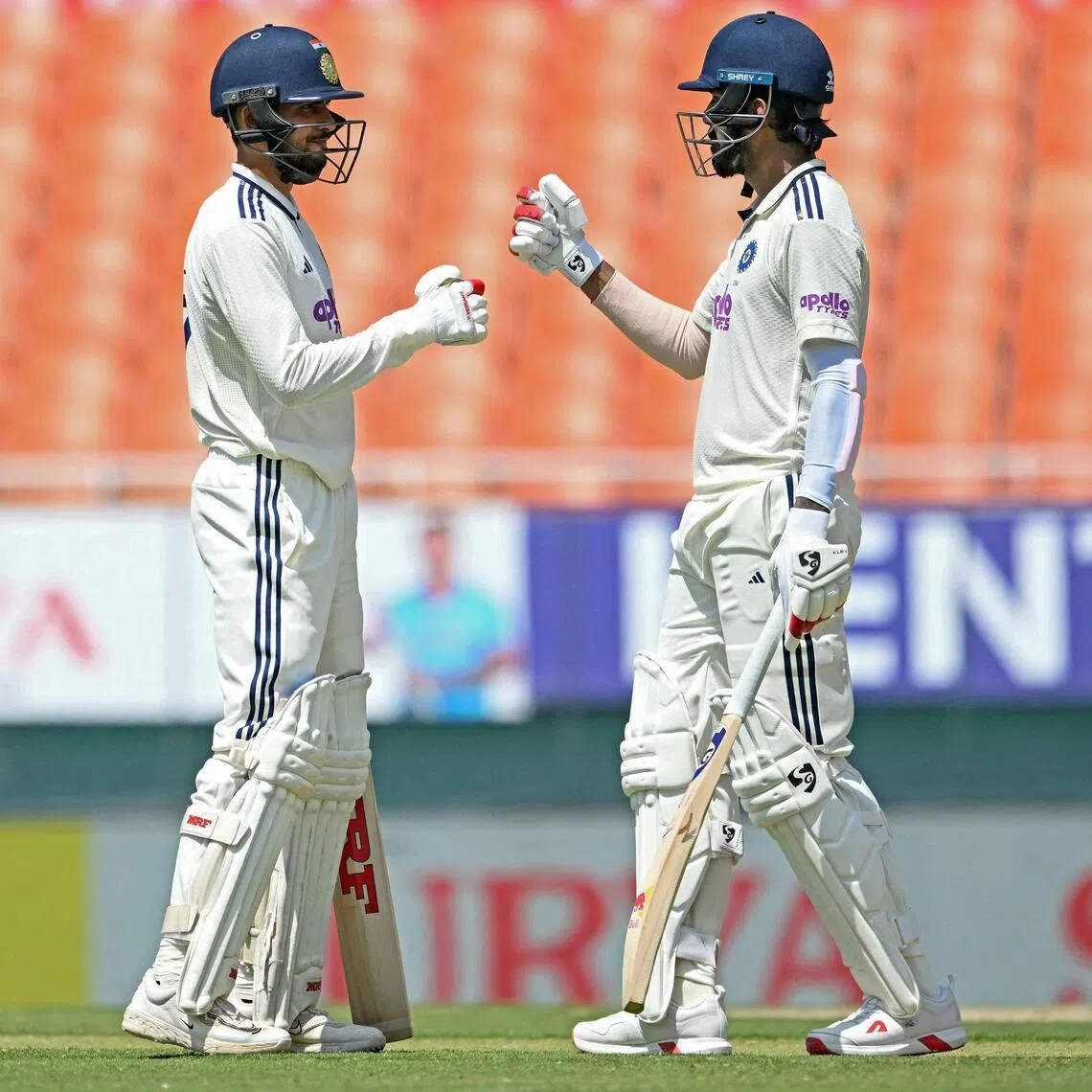 India's captain Shubman Gill (left) and K.L. Rahul bump fists on the first day of the only cricket Test against Afghanistan at the Maharaja Yadavindra Singh International Cricket Stadium on the outskirts of Chandigarh on June 6, 2026.