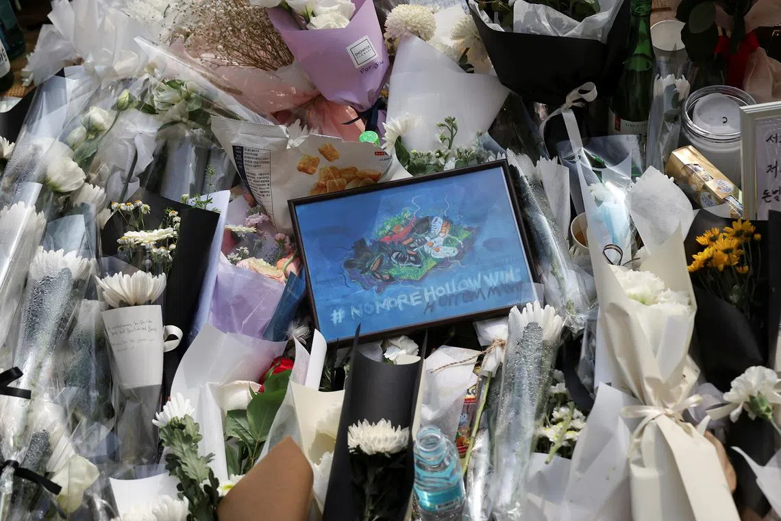 A view of tributes near the scene of a crowd crush that happened during Halloween festivities, in Seoul, South Korea, October 31, 2022. 
