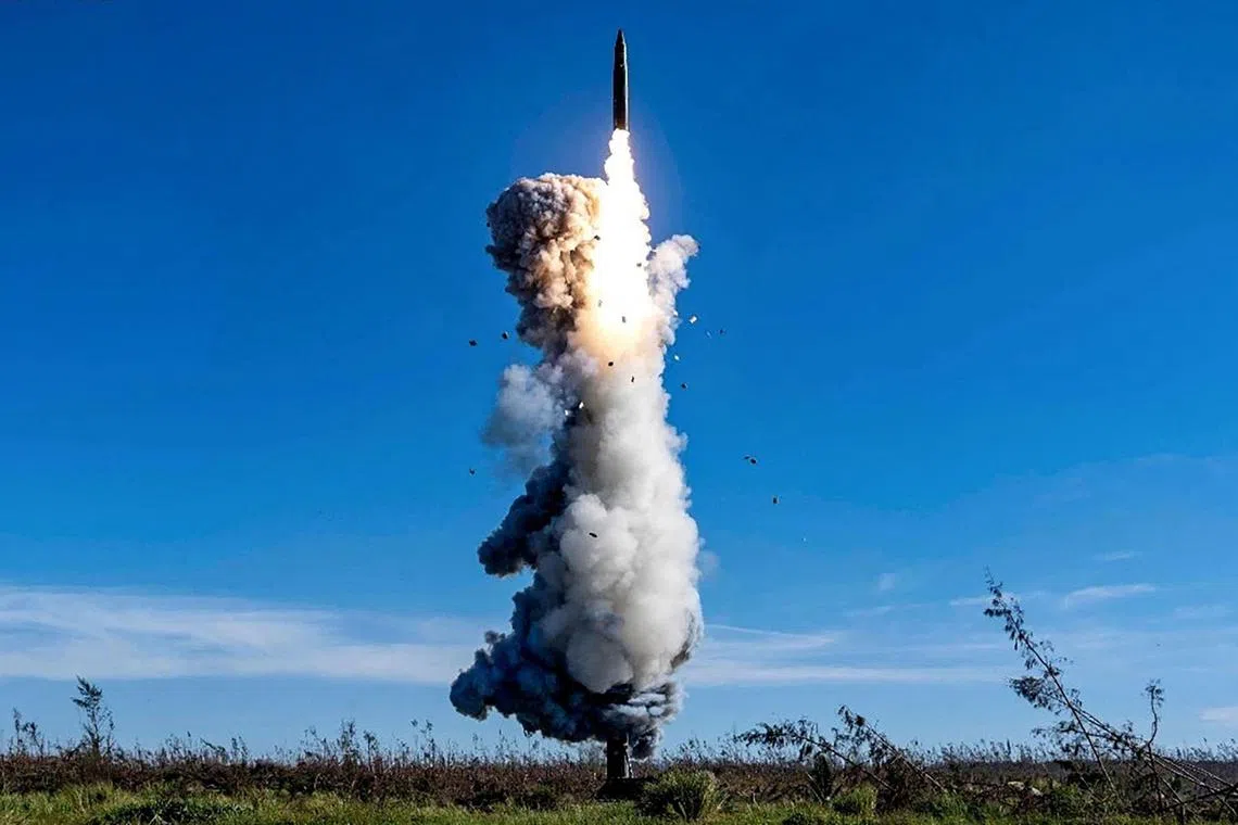 TOPSHOT - This handout photograph taken on September 25, 2024 and released by the Chinese People's Liberation Army News and Communication Center on September 26, 2024, shows the Chinese People's Liberation Army Rocket Force launching an intercontinental ballistic missile carrying a dummy warhead into the Pacific Ocean, at an undisclosed location. (Photo by HANDOUT / Chinese People's Liberation Army News and Communication Center / AFP) / -----EDITORS NOTE---EDITORIAL USE - MANDATARY CREDIT "AFP PHOTO / Chinese People's Liberation Army News and Communication Center " - NO MARKETING NO ADVERTISING CAMPAIGNS - DISTRIBUTED AS A SERVICE TO CLIENTS