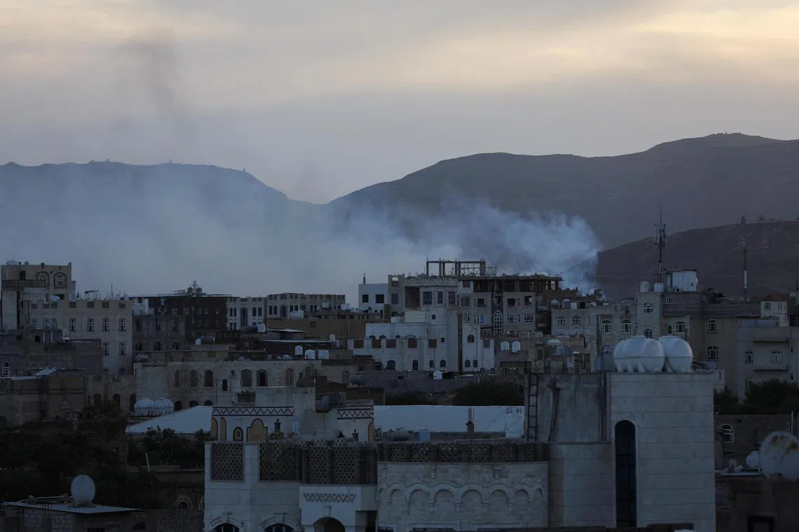 Smoke rising from the site of air strikes in Yemen's capital, Sanaa, on Oct 4. 