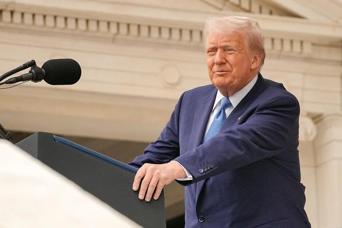 FILE PHOTO: U.S. President Donald Trump delivers remarks at the annual National Memorial Day Observance in the Memorial Amphitheater at Arlington National Cemetery in Arlington, Virginia, U.S., May 26, 2025. REUTERS/Ken Cedeno/File Photo