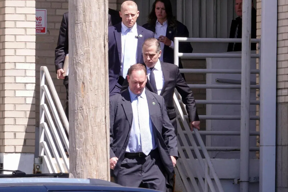 Mr Hunter Biden (centre) is in a dispute with the mother of his four-year-old child, over having his child support payments reduced.