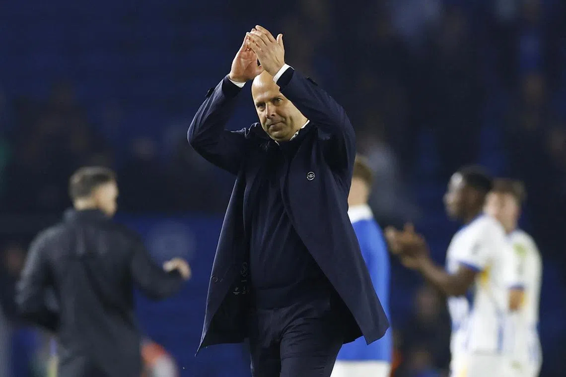 Liverpool manager Arne Slot applauds fans after the League Cup win over Brighton & Hove Albion.