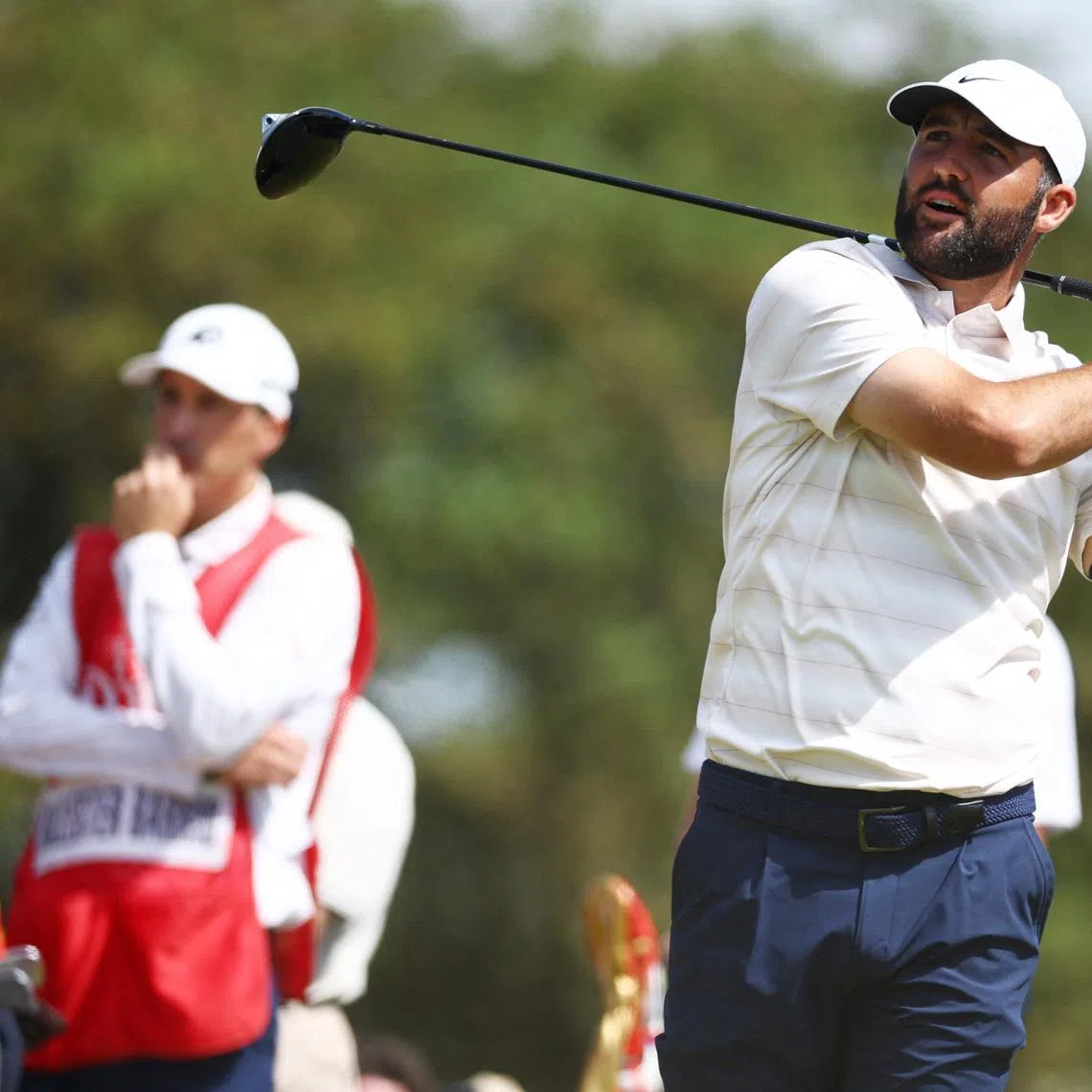 Golf - The 154th Open Championship - Royal Birkdale Golf Club, Southport, Britain - July 19, 2026 Scottie Scheffler of the U.S. watches his tee shot on the 2nd hole during the final round REUTERS/Phil Noble