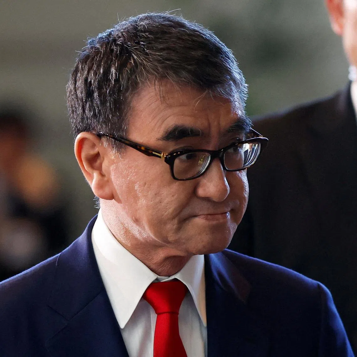 FILE PHOTO: Japan's Minister for Digital Transformation Taro Kono walks on the day of the cabinet reshuffle, at the Prime Minister's office in Tokyo, Japan September 13, 2023. REUTERS/Issei Kato/File Photo