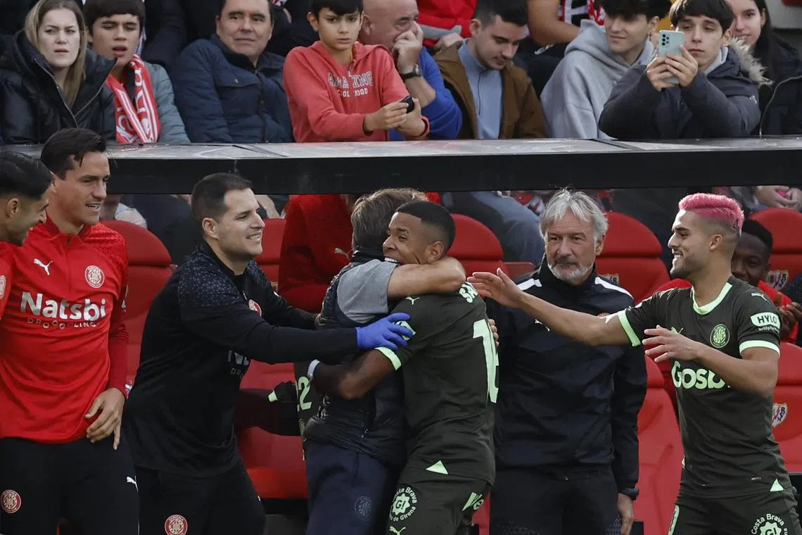 Girona midfielder Savio Moreira hugging a staff member after scoring their second goal in their 2-1 win over Rayo Vallecano on Nov 11.