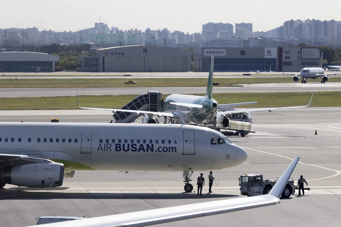 Man in South Korea investigated after fiddling with airplane emergency door