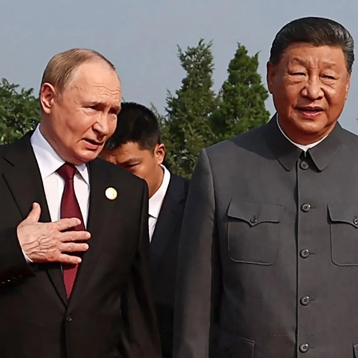 Russia's President Vladimir Putin (left) walks with China's President Xi Jinping in Beijing’s Tiananmen Square on Sept 3.