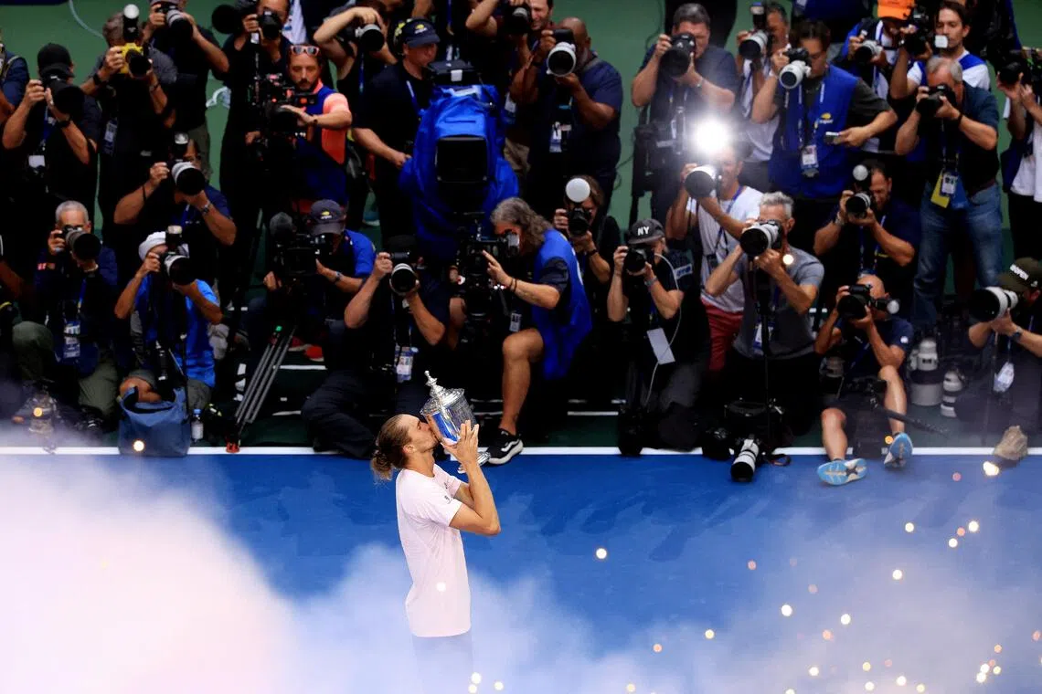 Germany’s Alexander Zverev celebrates with the trophy after winning the men’s singles final.