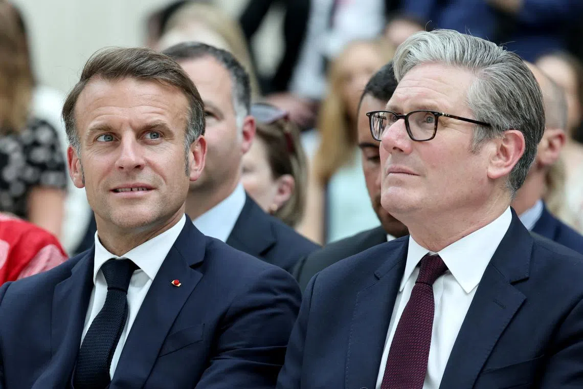 France's President Emmanuel Macron and Britain's Prime Minister Keir Starmer attend a ceremony during their visit to The British Museum in London, Britain, July 9, 2025. LUDOVIC MARIN/Pool via REUTERS