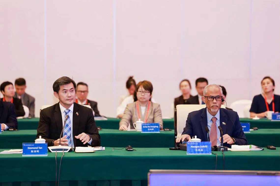 Senior Minister of State in the Prime Minister’s Office Desmond Tan (left) and Minister for Social and Family Development Masagos Zulkifli at the 11th Singapore-Liaoning Economic and Trade Council meeting in Shenyang on Aug 11.