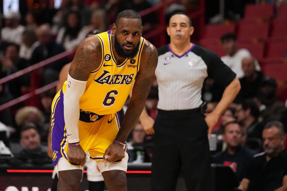 Los Angeles Lakers forward LeBron James stands on the court after arguing a call with referee Curtis Blair during the second half at FTX Arena.
