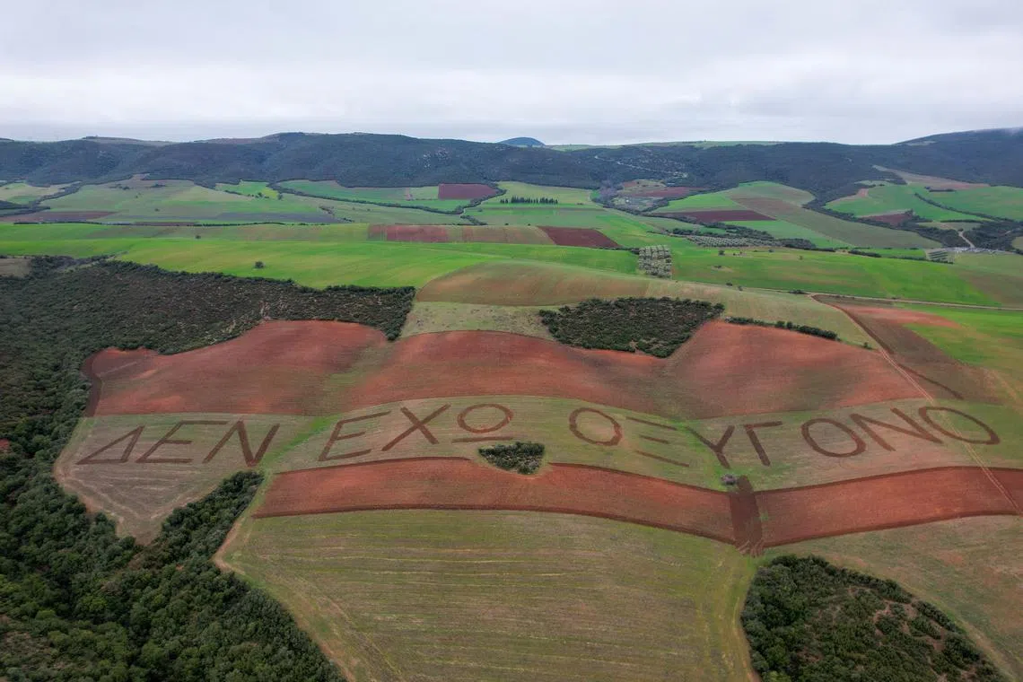 A message ploughed across fields reading "I have no oxygen", a phrase a victim of a deadly train accident in 2023 that killed 57 passengers, used in a phone call to the emergency services, in the village of Galarinos, Greece, Feb 18, 2025. 