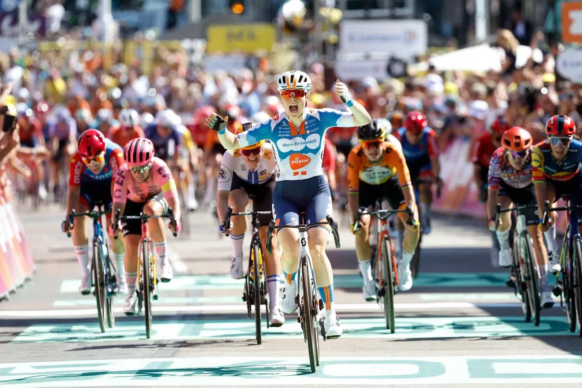Charlotte Kool celebrates her victory in the first stage of the Tour de France Femmes from Rotterdam to The Hague. The multi-day cycling race is part of the UCI Women's World Tour and lasts until Aug 18, 2024.