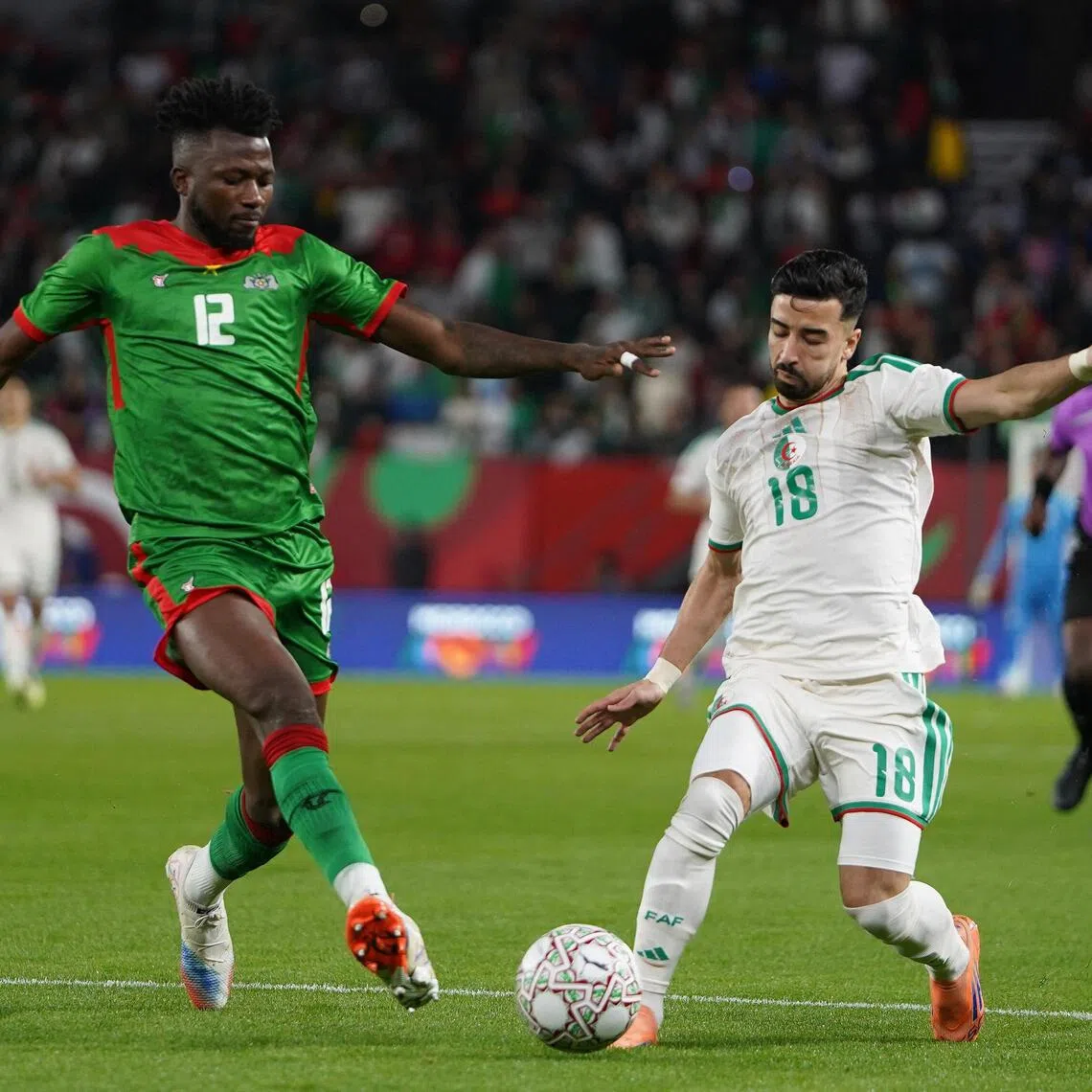 Burkina Faso's Edmond Tapsoba challenging Algeria's Mohamed Amoura in their CAF Africa Cup of Nations Group C game at Prince Moulay Hassan Stadium in Rabat, Morocco on Dec 28, 2025.