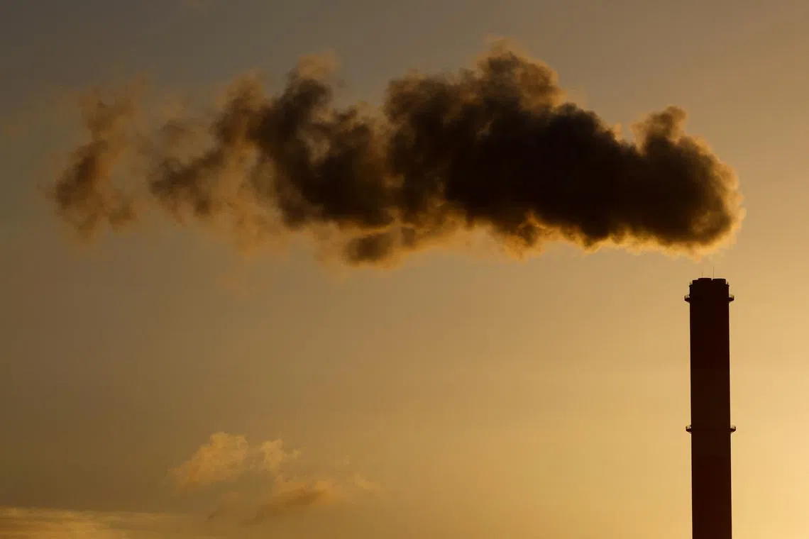 FILE PHOTO: A view shows emissions from the smoke stack of the Electricite de France (EDF) coal-fired power plant in Cordemais near Nantes, France, January 20, 2022. REUTERS/Stephane Mahe/File Photo