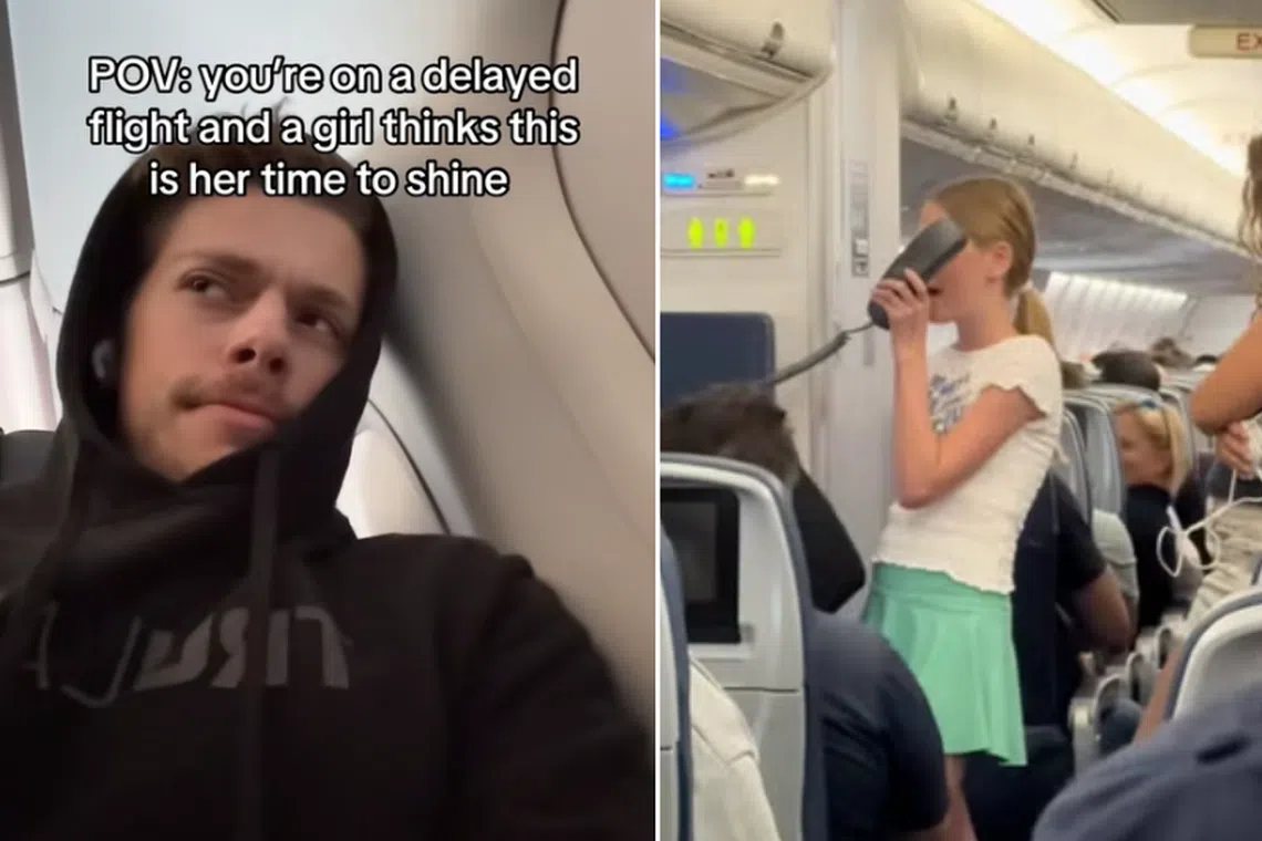 The girl was singing to a planeload of passengers enduring more than four hours of delay.