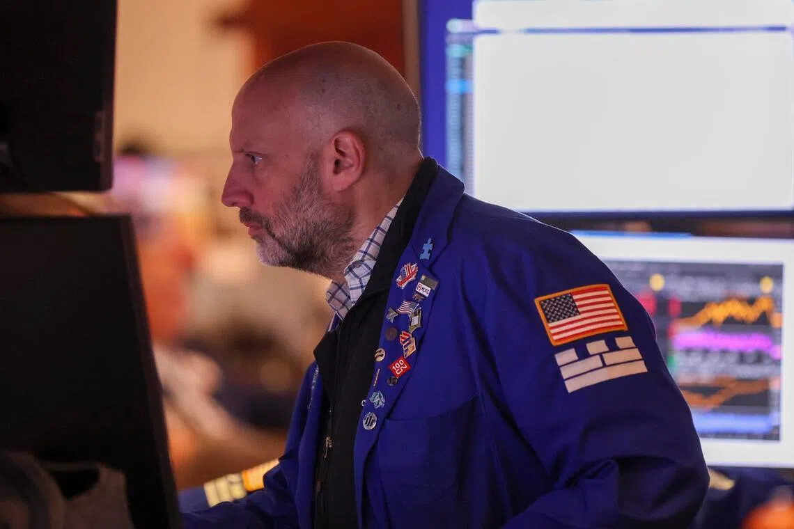 A trader working on the floor of the New York Stock Exchange, in New York City.