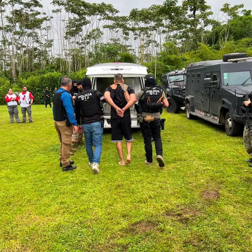 Authorities of Costa Rica's Judicial Investigation Agency (OIJ) escort Alejandro Arias, known as \"El Diablo,\" the Central American country's most wanted fugitive and a suspect sought by the United States on drug trafficking charges, in Alajuela, Costa Rica, in this handout image distributed on July 24, 2026. Judicial Investigation Agency (OIJ)/Handout via REUTERS