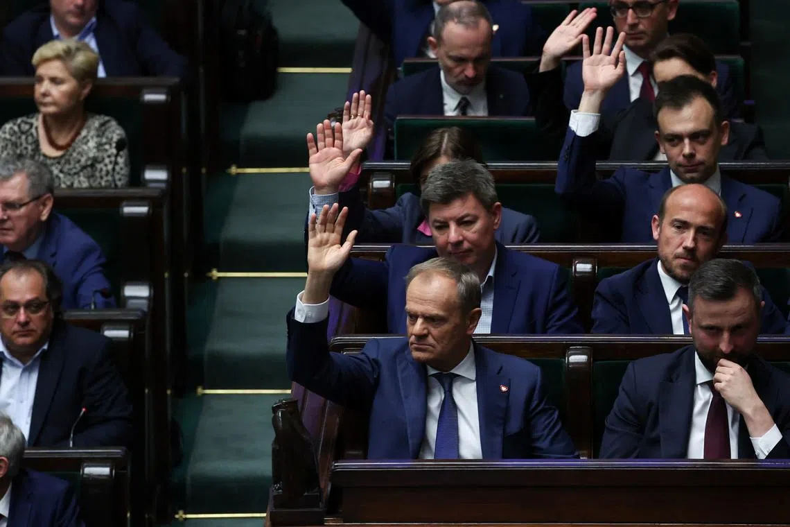 Polish Prime Minister Donald Tusk takes part in voting on sending four bills on the liberalisation of abortion laws to be analysed by a special commission, at the parliament in Warsaw, Poland, April 12, 2024. REUTERS/Kacper Pempel/File Photo