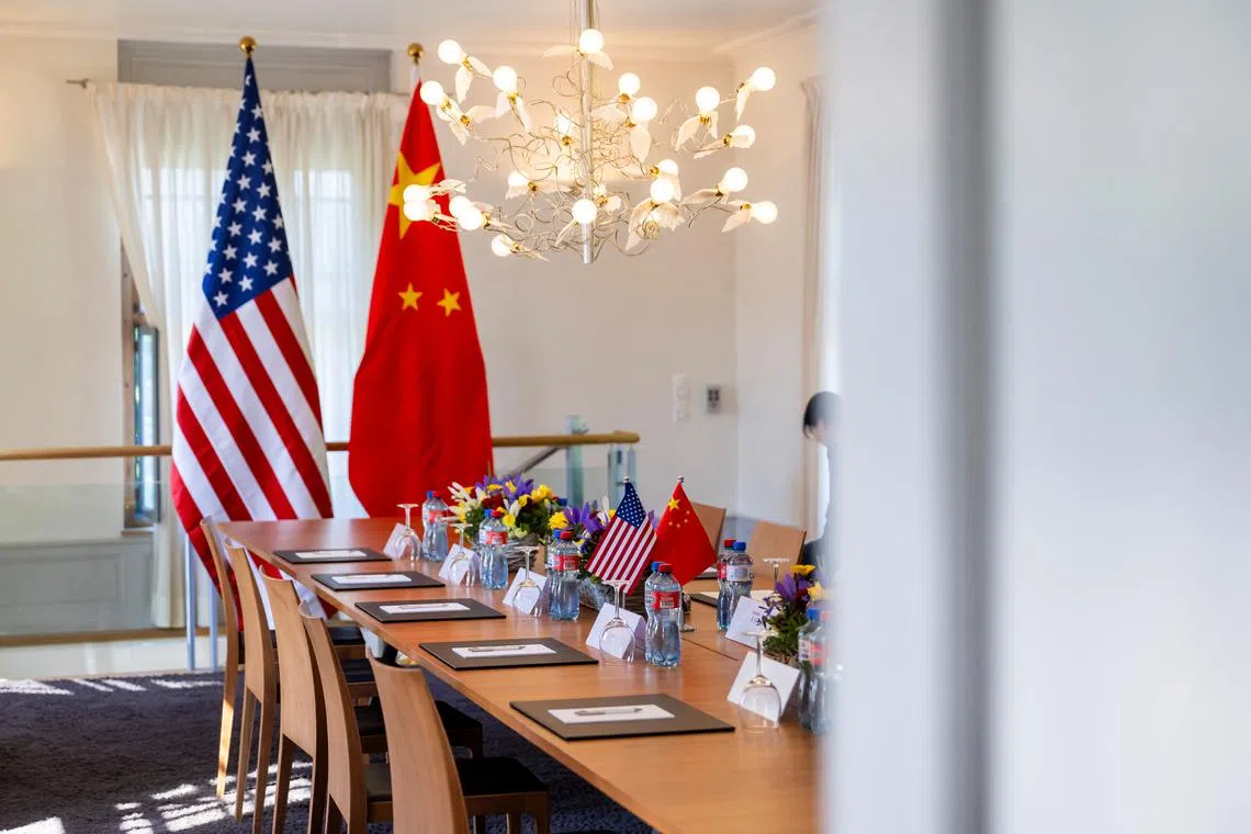 FILE PHOTO: The U.S. and Chinese flags are seen on the day of a bilateral meeting between the U.S. and China, in Geneva, Switzerland, May 11, 2025. KEYSTONE/EDA/Martial Trezzini/Handout via REUTERS/File Photo