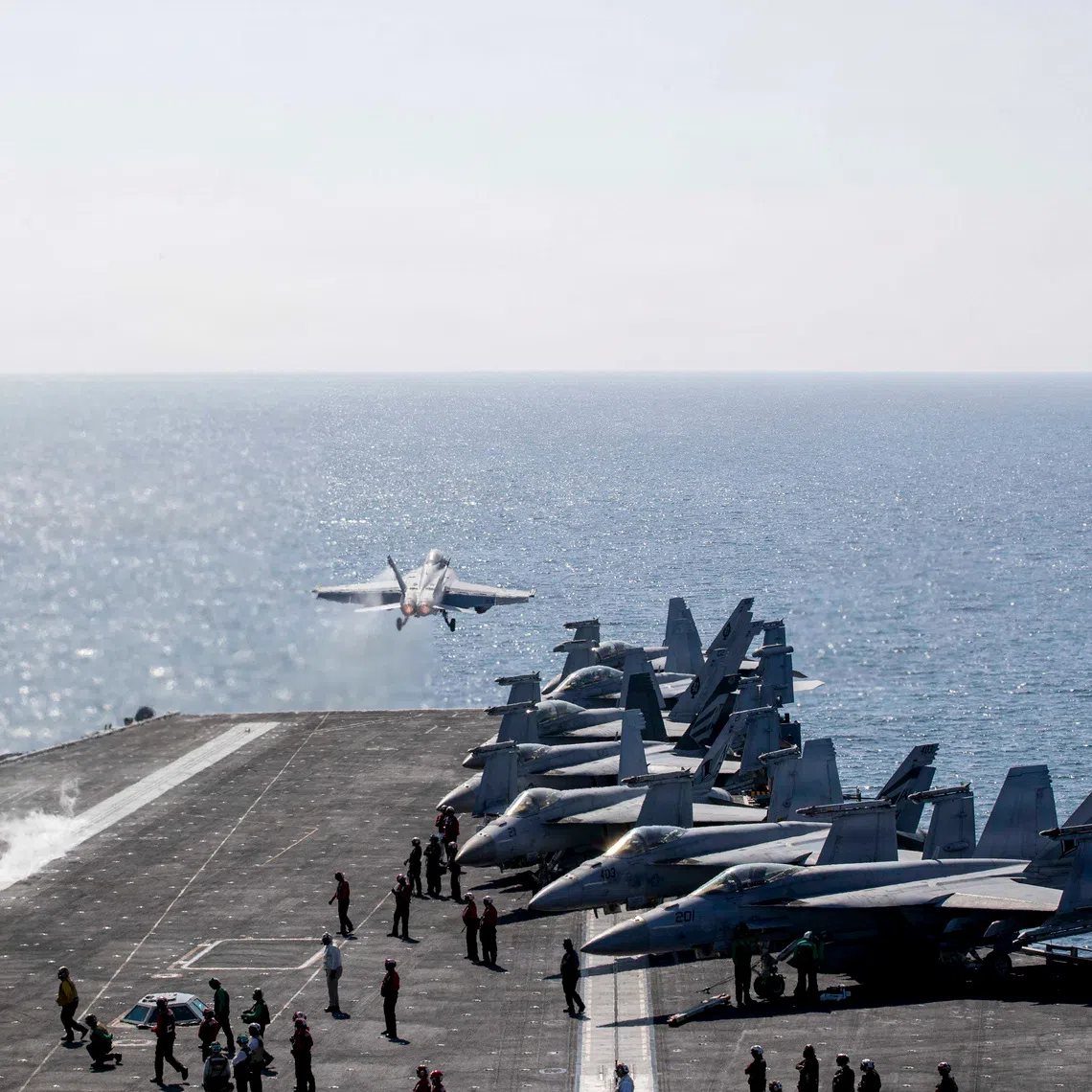 Two F/A-18 Super Hornets are launched from the flight deck of the US Navy Nimitz-class aircraft carrier USS Abraham Lincoln on March 3 to support the Operation Epic Fury attack on Iran.