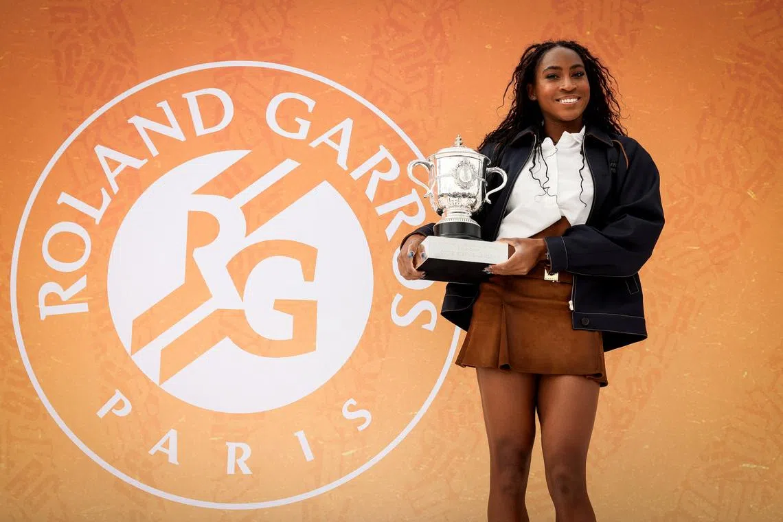 Tennis - French Open - Place de la Concorde, Paris, France - June 8, 2025 Coco Gauff of the U.S. poses with the trophy after winning the French Open women's singles Thomas Padilla/Pool via REUTERS