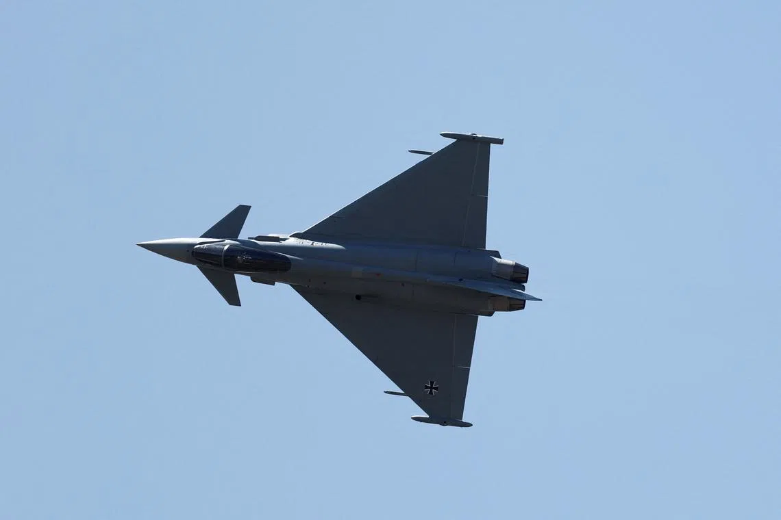 FILE PHOTO: A German Air Force Eurofighter Typhoon jet during an air display at the 55th International Paris Airshow at Le Bourget Airport near Paris, France, June 18, 2025. REUTERS/Benoit Tessier/File Photo