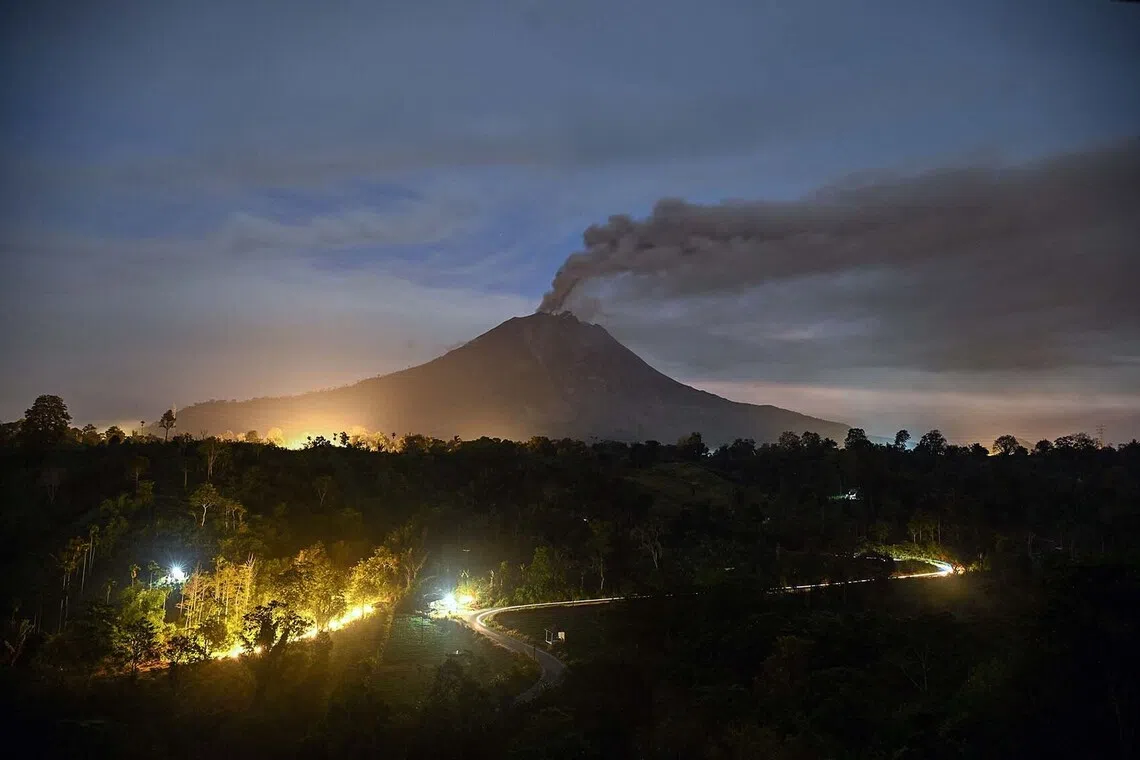 CORRECTION / Mount Sinabung spews ash and thick smoke as seen from Karo, North Sumatra province early on September 2, 2026. (Photo by Yt HARYONO / AFP) / “The erroneous mention[s] appearing in the metadata of this photo has been modified in AFP systems in the following manner: [YT HARYONO] instead of [ARIANDI]. Please immediately remove the erroneous mention[s] from all your online services and delete it (them) from your servers. If you have been authorized by AFP to distribute it (them) to third parties, please ensure that the same actions are carried out by them. Failure to promptly comply with these instructions will entail liability on your part for any continued or post notification usage. Therefore we thank you very much for all your attention and prompt action. We are sorry for the inconvenience this notification may cause and remain at your disposal for any further information you may require.”
