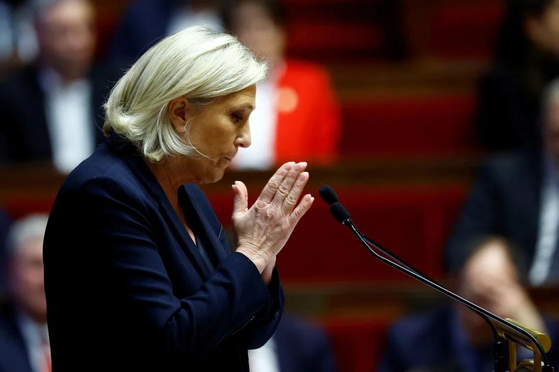 FILE PHOTO: French far-right leader and member of parliament Marine Le Pen, President of the French far-right National Rally (Rassemblement National - RN) party parliamentary group, gestures as she delivers a speech at the National Assembly in Paris, France, December 4, 2024. REUTERS/Sarah Meyssonnier/File Photo