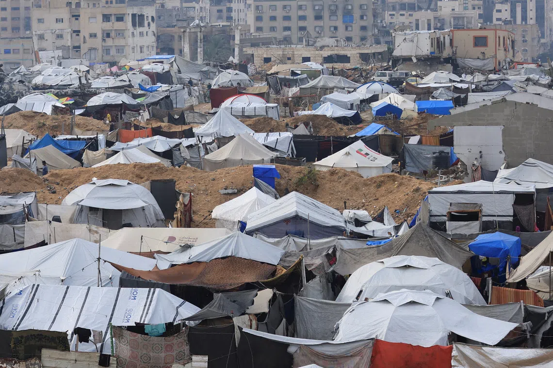 Palestinian-tent shelter on a rainy day, during a ceasefire between Israel and Hamas, in Gaza City, November 14, 2025. REUTERS/Dawoud Abu Alkas