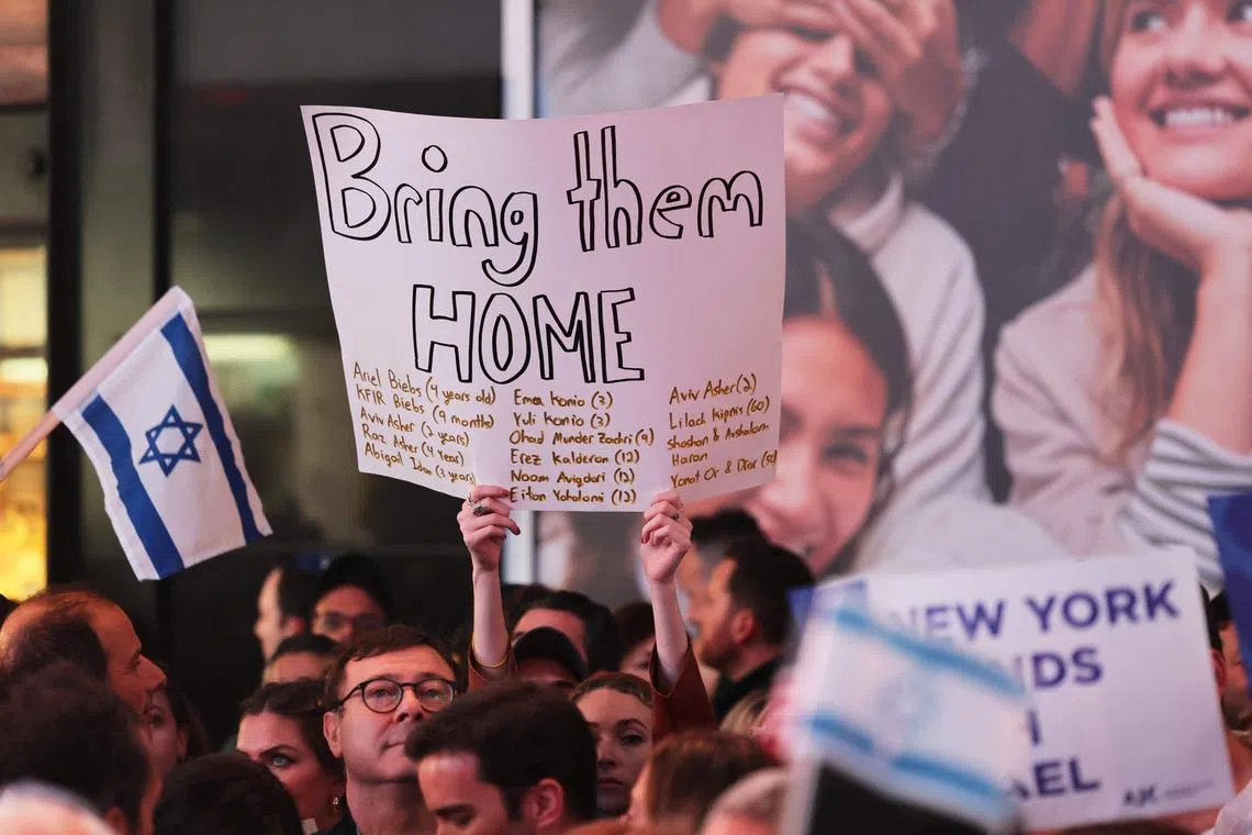 People gather for a rally in Times Square demanding the freeing of hostages taken in the Oct 7 attack by Hamas.