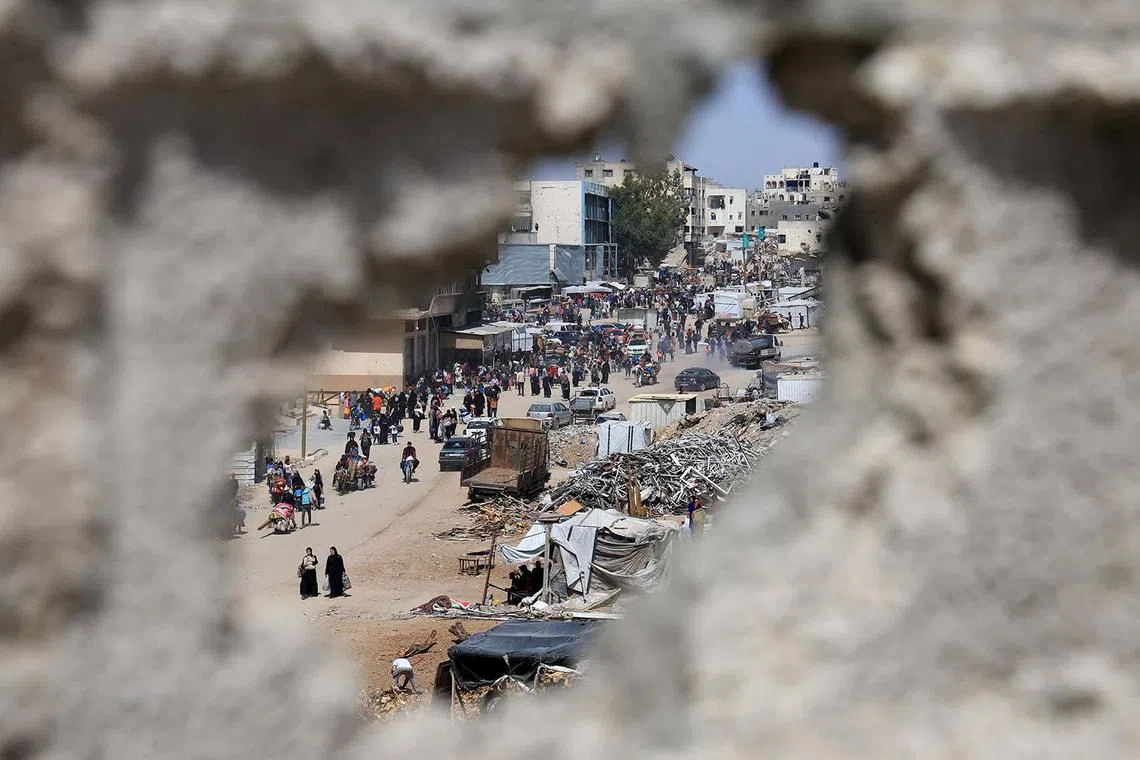 Palestinians on the move as they flee their homes after the Israeli military issued orders for evacuation from eastern Khan Younis, in the southern Gaza Strip, May 19, 2025. 