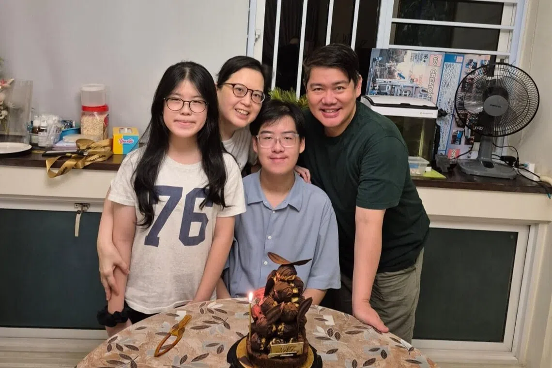 53-year-old cpf member calvin chew with wife and two teenage children sandwich generation