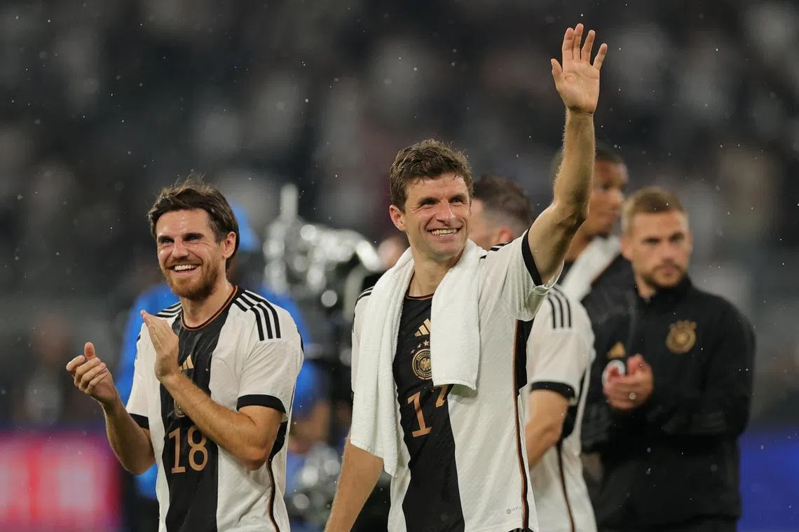 Germany's Thomas Mueller (right) and teammate Jonas Hofmann (left) celebrate after the match.