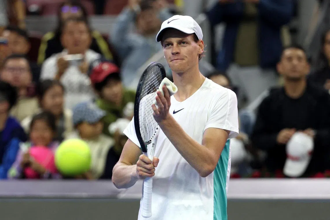 Italy's Jannik Sinner celebrates after winning his semi-final match against Spain's Carlos Alcaraz.