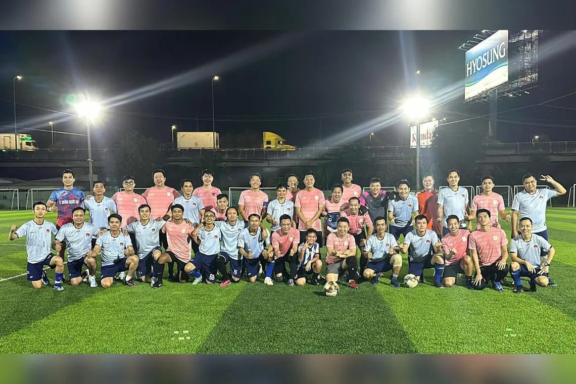 Stripes FC pose for a photo with their Vietnamese opponents from YBA FC during the teams' friendly match in November 2024 held in Ho Chi Minh.