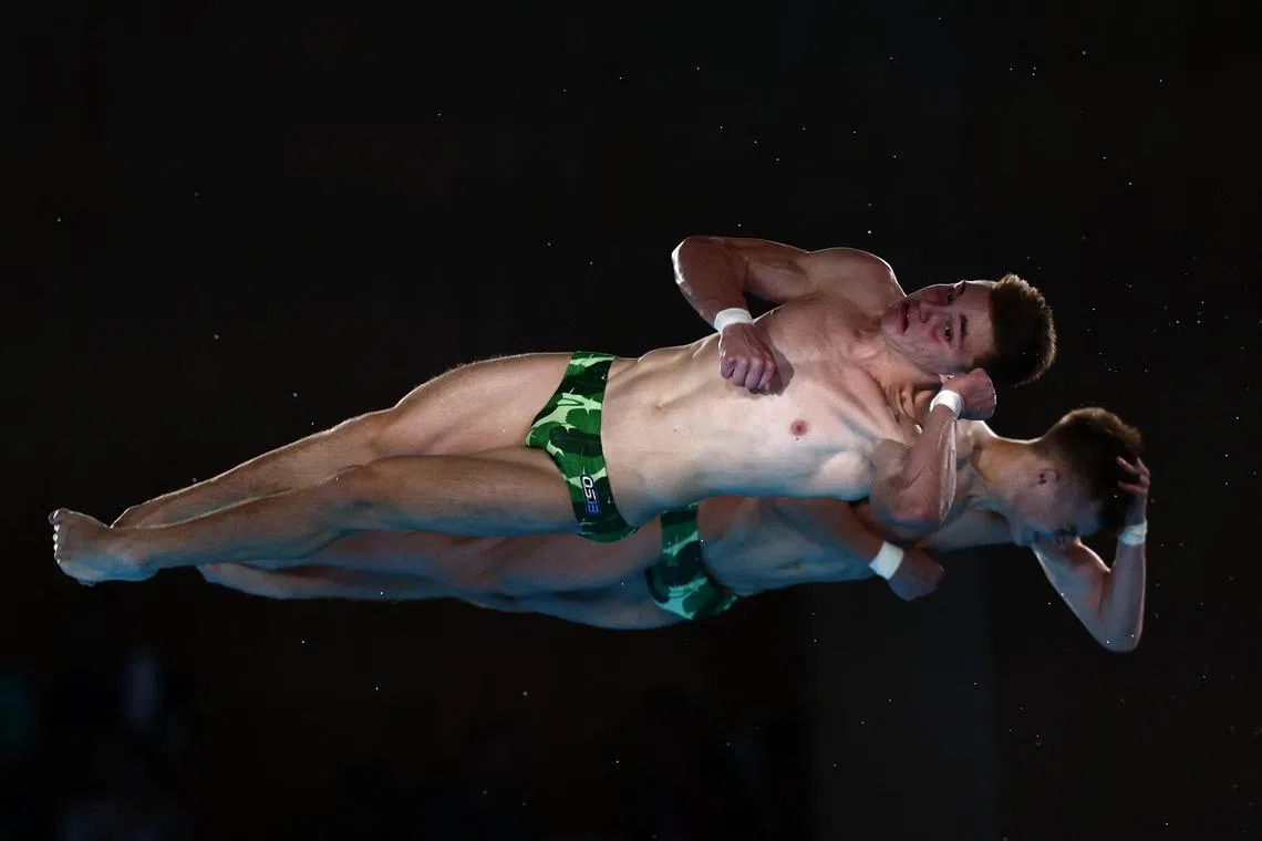 Paris 2024 Olympics - Diving - Men's Synchronised 10m Platform Final - Aquatics Centre, Saint-Denis, France - July 29, 2024. Kirill Boliukh of Ukraine and Oleksii Sereda of Ukraine in action REUTERS/Gonzalo Fuentes
