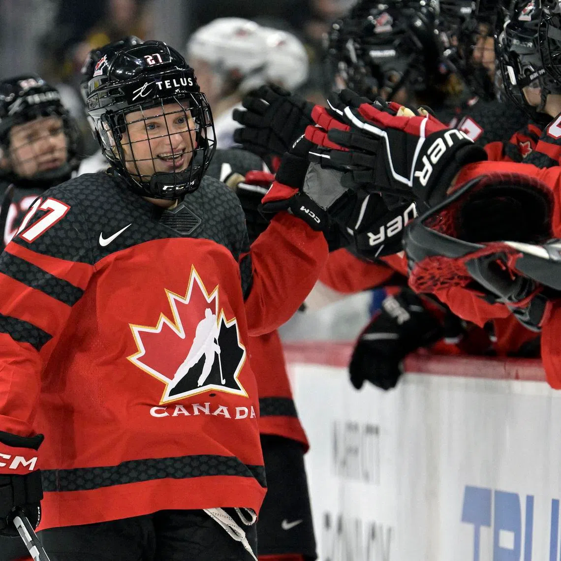 Feb 11, 2024; Saint Paul, Minnesota, USA; Team Canada forward Emma Maltais (27) celebrates her goal against Team USA during the third period of a Rivalry Series women's ice hockey game at Xcel Energy Center. Mandatory Credit: Nick Wosika-USA TODAY Sports