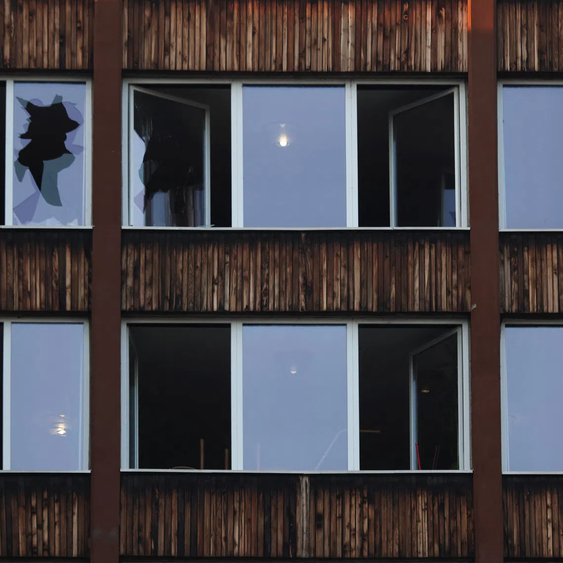 Damaged windows after a fire at an elderly people's home in the town of Tuzla, Bosnia and Herzegovina, November 5, 2025. REUTERS/Amel Emric