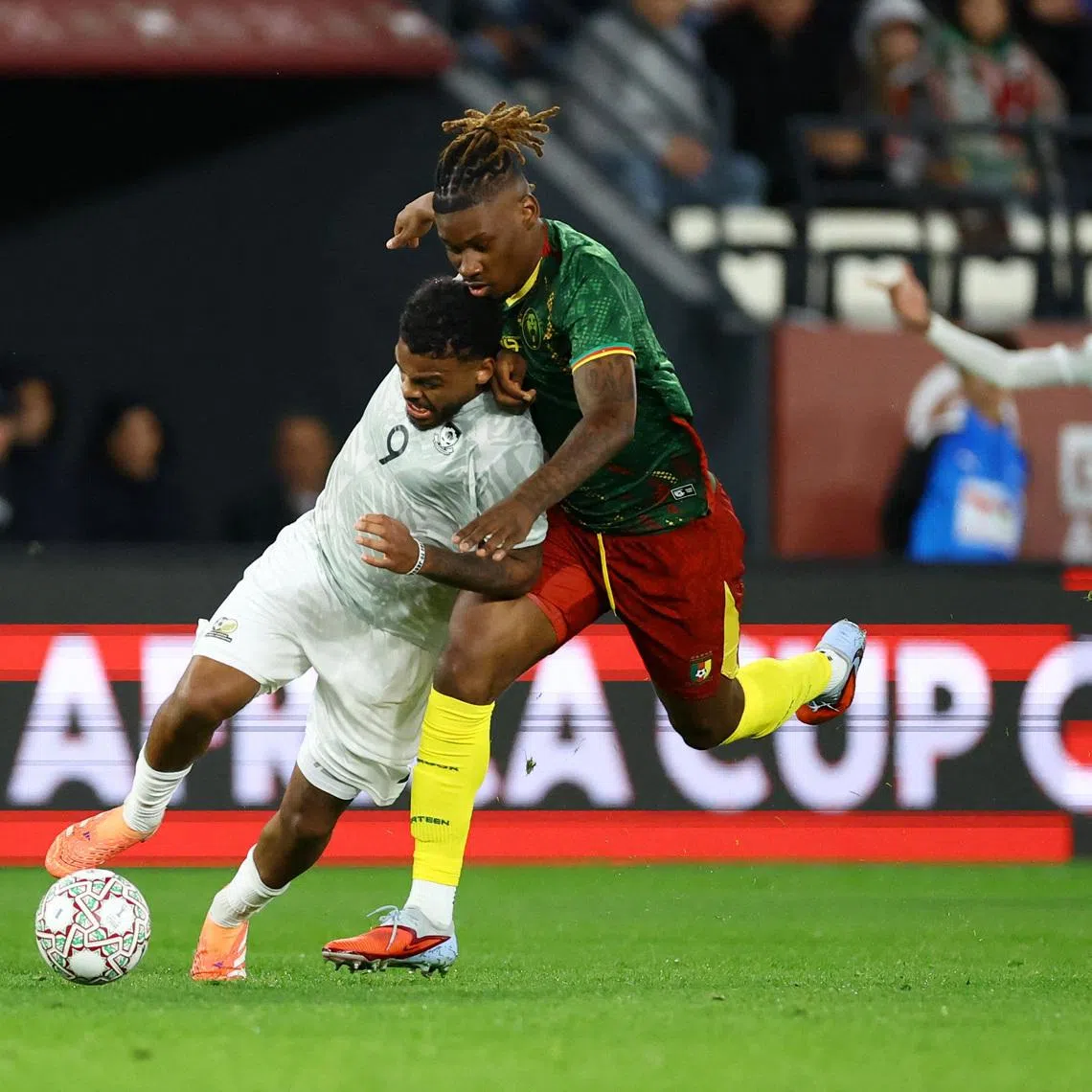Soccer Football - CAF Africa Cup of Nations - Morocco 2025 - Round of 16 - South Africa v Cameroon - Al Medina Stadium, Rabat, Morocco - January 4, 2026 South Africa's Lyle Foster in action with Cameroon's Christopher Wooh REUTERS/Siphiwe Sibeko