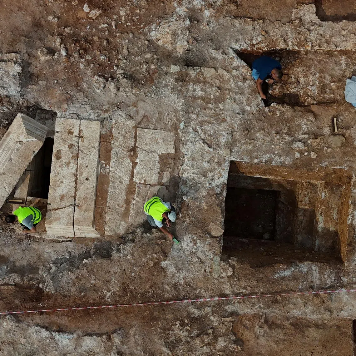 A drone view shows archaeologists working on Albania's first discovered monumental tomb, which they suggest may be a mausoleum, dated to the Roman period III–IV century AD, in Strikcan, Albania, September 4, 2025. REUTERS/Florion Goga
