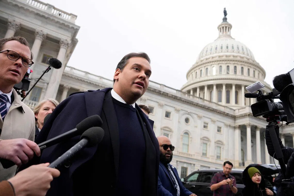 George Santos is surrounded by journalists as he leaves the US Capitol, after his fellow members of Congress voted to expel him from the House of Representatives.