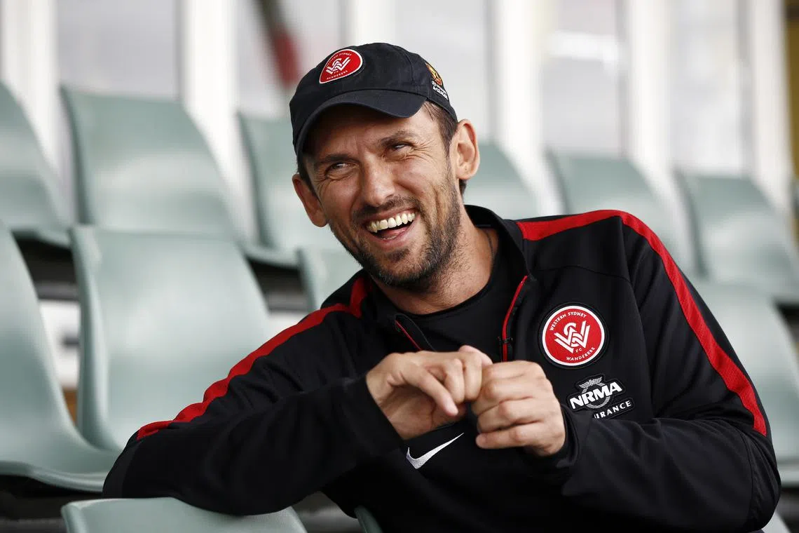FILE PHOTO: Western Sydney Wanderers soccer team coach Tony Popovic laughs at the team's training facility at Rooty Hill in the western suburbs of Sydney, October 21, 2014/REUTERS/Jason Reed/File Photo