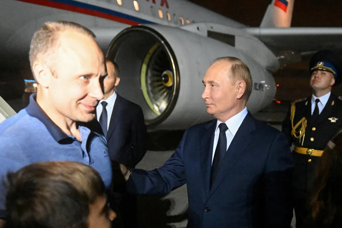 Russia's President Vladimir Putin welcomes Russian national Artyom Dultsev, who was released in a prisoner exchange between Russia with Western countries, during a ceremony at Vnukovo International Airport in Moscow, Russia August 1, 2024. Sputnik/Mikhail Voskresensky/Pool via REUTERS